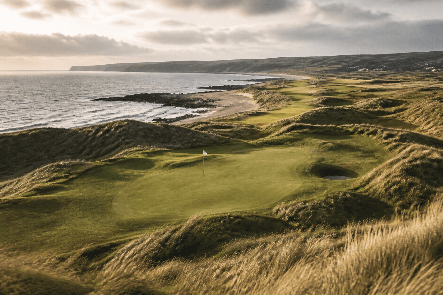 Illustrative North Coast-inspired links landscape beside the sea
